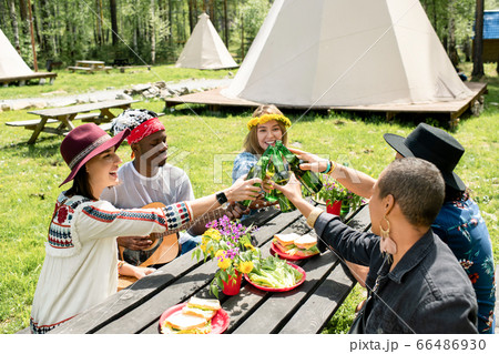 Drinking beer with friends at campsite Drinking beer with friends at campsite 66486930