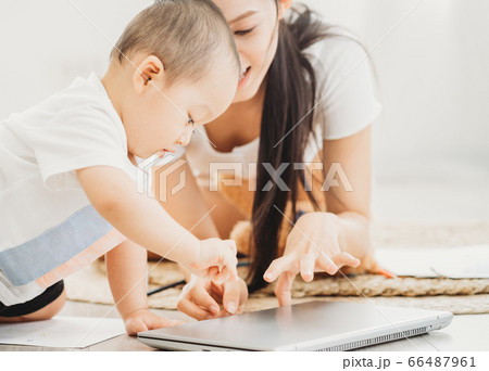Mother and son playing at home 66487961