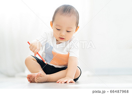 A child playing on the floor A child playing on the floor 66487968