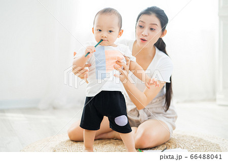 Mother and son playing on the floor Mother and son playing on the floor 66488041