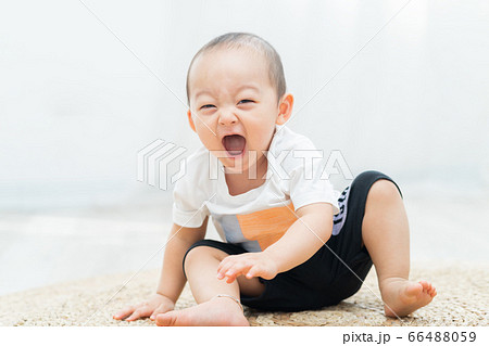 A child playing on the floor A child playing on the floor 66488059