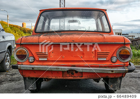 Bright red soviet retro car ZAZ or Zaporozhets. 66489409