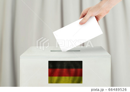 Germany Vote concept. Voter hand holding ballot Germany Vote concept. Voter hand holding ballot 66489526
