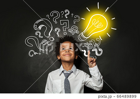 Clever little boy on black background with light Clever little boy on black background with light 66489899
