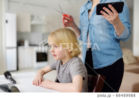 Preschooler boy gets haircut at home during quarantine Preschooler boy gets haircut at home during quarantine 66489988