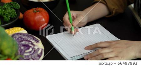 Close up view of female student taking recipe 66497993