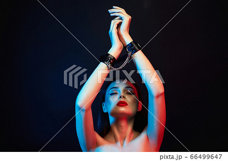 Girl in handcuffs. slave Beautiful young Woman in 66499647
