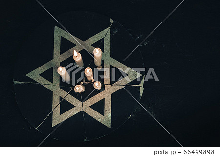 Six burning candles and the Star of David against 66499898