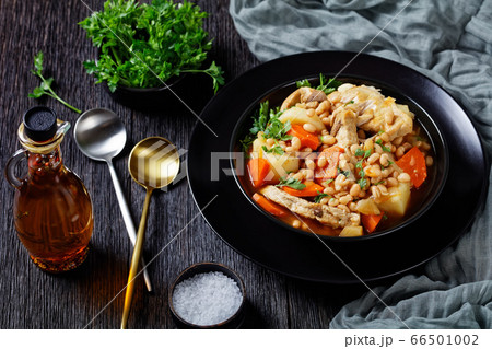 a portion of bean, vegetables and pork stew 66501002