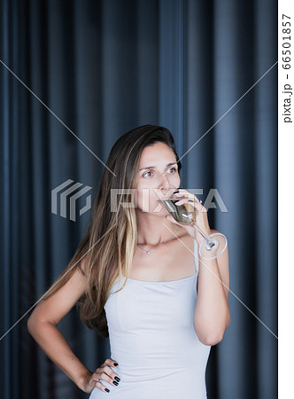 Indoor portrait of a woman with wine Indoor portrait of a woman with wine 66501857