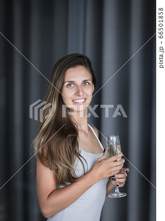 Indoor portrait of a woman with wine Indoor portrait of a woman with wine 66501858
