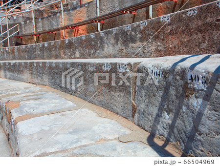 restored ancient amphitheater with stone seats 66504969