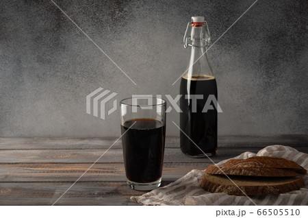 Homemade tradishional russian drink kvass with glass cup and bread. Rustic style and copy space Homemade tradishional russian drink kvass with glass cup and bread. Rustic style and copy space 66505510