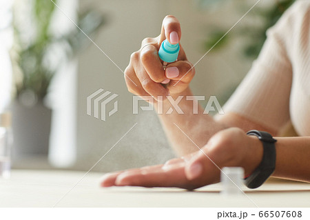 Woman Spraying Hand Sanitizer Close Up Woman Spraying Hand Sanitizer Close Up 66507608