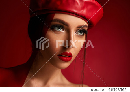 woman in red leather beret 66508562