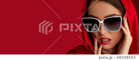 girl in white sunglasses and red headscarf 66508563