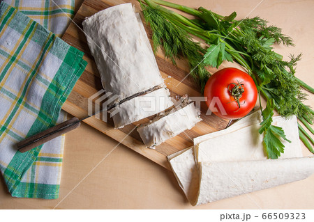 Pieces of cutted pita bread or lavash roll with 66509323