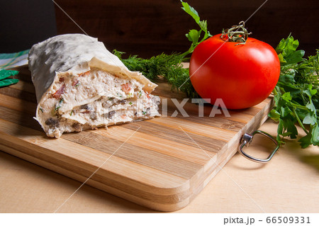 Pita bread or lavash wrapped with cottage cheese 66509331