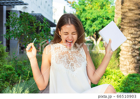 Beautiful woman is happy because of crazy idea Beautiful woman is happy because of crazy idea 66510903