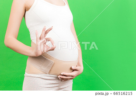 Close up of pregnant woman wearing supporting 66516215