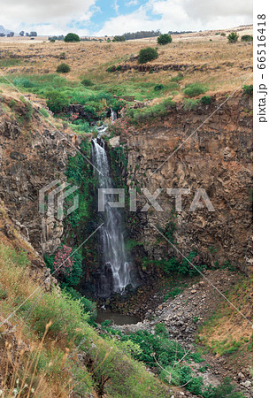 Gamla waterfall against the blue sky 66516418