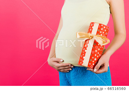 Cropped image of pregnant woman in white underwear 66516560