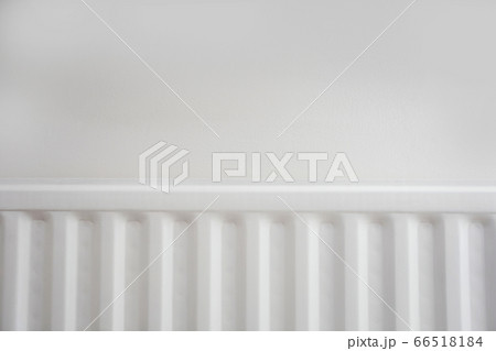 Close up of radiator against white wall modern new retro design. 66518184
