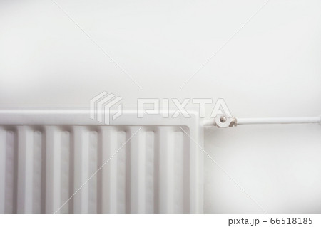 Close up of radiator against white wall modern new retro design. Close up of radiator against white wall modern new retro design. 66518185