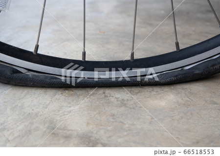 Flat Bicycle Tire on the Street 66518553