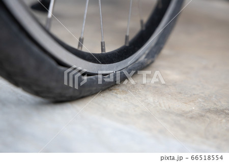 Flat Bicycle Tire on the Street 66518554