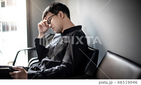 Asian Businessman feeling stressed in meeting room Asian Businessman feeling stressed in meeting room 66519046