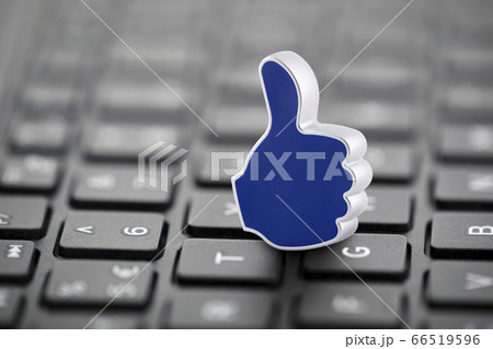 Thumb Up graphic illustration on laptop keyboard 66519596