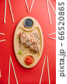 Eel sushi roll on wooden plate red background 66520865