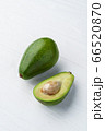 Avocados on white wooden background 66520870