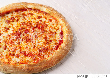 Fresh Italian cheese pizza on white wooden background 66520871