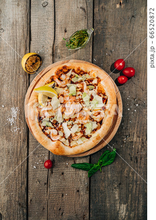 Tasty Shrimp Pizza on wooden background Tasty Shrimp Pizza on wooden background 66520872