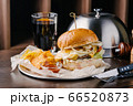 Delicious burger with beef and cheese 66520873