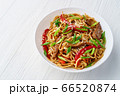 Udon noodles with beef on white wooden background 66520874