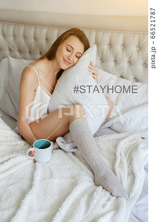 Young woomen in bed with pillow. Happy girl at home. Good sleeping concept Young woomen in bed with pillow. Happy girl at home. Good sleeping concept 66521787