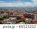 The capital of Portugal, Lisbon, top view of the orange roofs of houses, hotels, the sea coast The capital of Portugal, Lisbon, top view of the orange roofs of houses, hotels, the sea coast 66523202