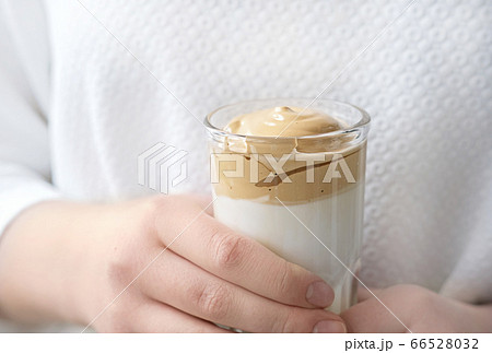 Iced frothy Dalgona Coffee, a trendy fluffy creamy whipped coffee. Iced frothy Dalgona Coffee, a trendy fluffy creamy whipped coffee. 66528032