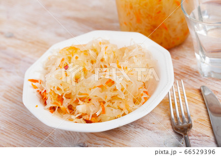 Homemade sauerkraut on white plate Homemade sauerkraut on white plate 66529396