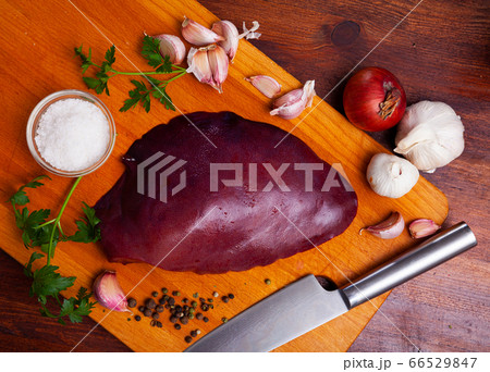 Cooking pork liver with parsley and garlic on the table 66529847