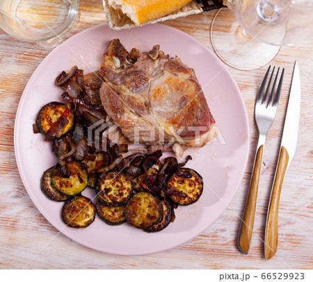 Roasted pork chop with zucchini Roasted pork chop with zucchini 66529923