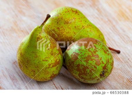 Fresh pears on wooden surface 66530388