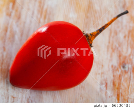 Exotic tropical tamarillo fruit on wooden table Exotic tropical tamarillo fruit on wooden table 66530483