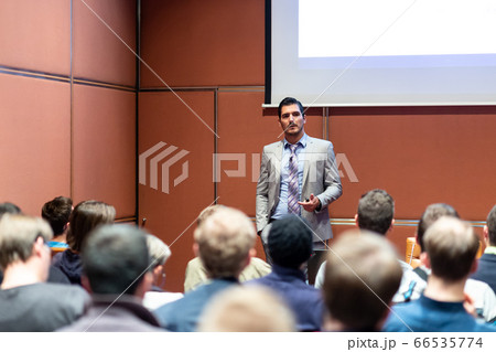 Business speaker giving a talk at business conference meeting event. 66535774