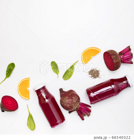 Healthy beetroot juice in a jars on white table 66540322