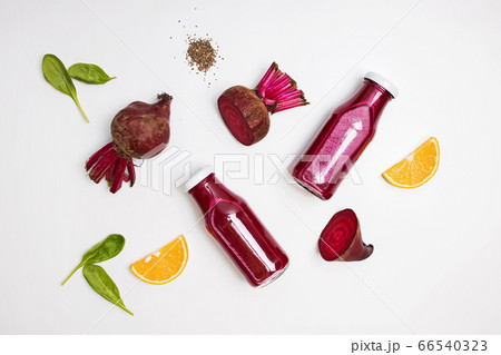 Healthy beetroot juice in a jars on white table Healthy beetroot juice in a jars on white table 66540323