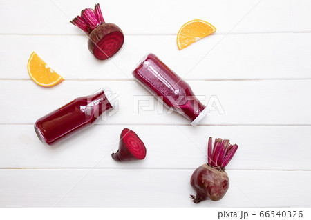 Healthy beetroot juice in a jars on white table 66540326